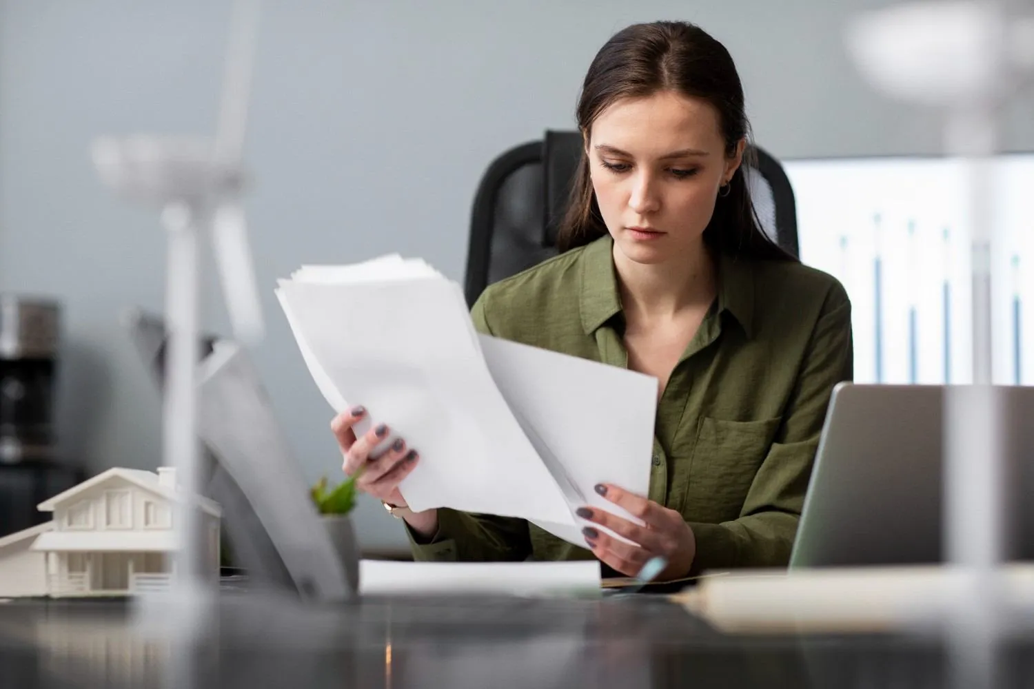 Homeowner reading solar billing paperwork